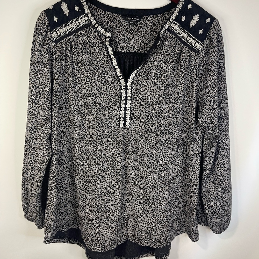 Lucky brand long sleeve embroidered v neck pattern top.